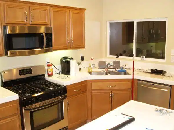 Kitchen with new stove, microwave and dishwasher installed