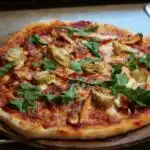 Pizza: Grilled chicken, artichoke hearts, and arugula