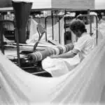 Ironing sheets at Central Linen Service, Dudley Park