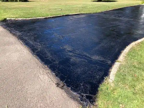 2022-08-03 15 58 00 A freshly sealed asphalt driveway along Van Duyn Drive in Ewing Township, Mercer County, New Jersey