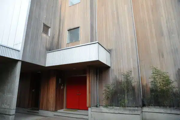 Contemporary house, entrance, red doors, aluminum awning, wood walls, bamboo, North Matthews Beach, Sand Point Way Uplands, Seattle, Washington, USA