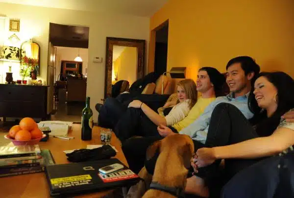 Kristen, Max, Hau, and Dani, enjoy a joke, Rosie the dog, laptop (Think), oranges, wine, living room, Wedgwood, Seattle, Washington, USA
