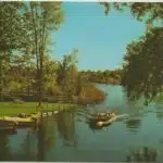 NW Bellaire MI 1950s Old Wood Speedboat on Intermediate River looking to Lake Bellaire in Antrim County Scene Photo taken at County Road 620