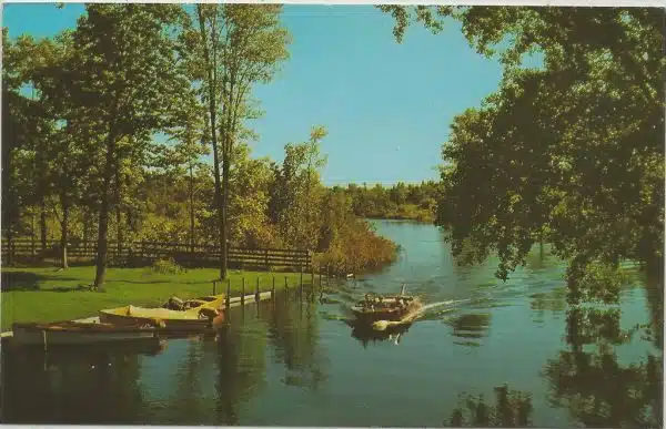 NW Bellaire MI 1950s Old Wood Speedboat on Intermediate River looking to Lake Bellaire in Antrim County Scene Photo taken at County Road 620