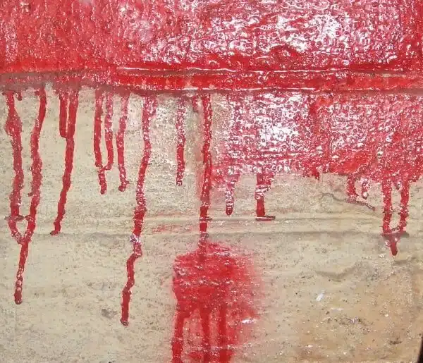 * Red Paint Dripping On Cement *