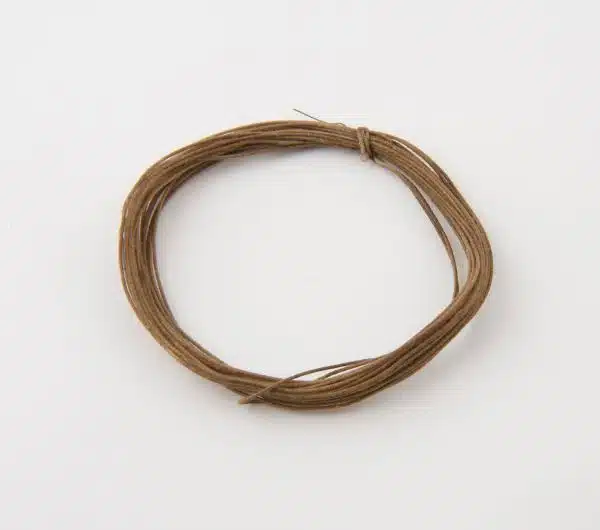 Coil of cotton covered electric wire used in connecting electric detonator circuit in mining (coil)